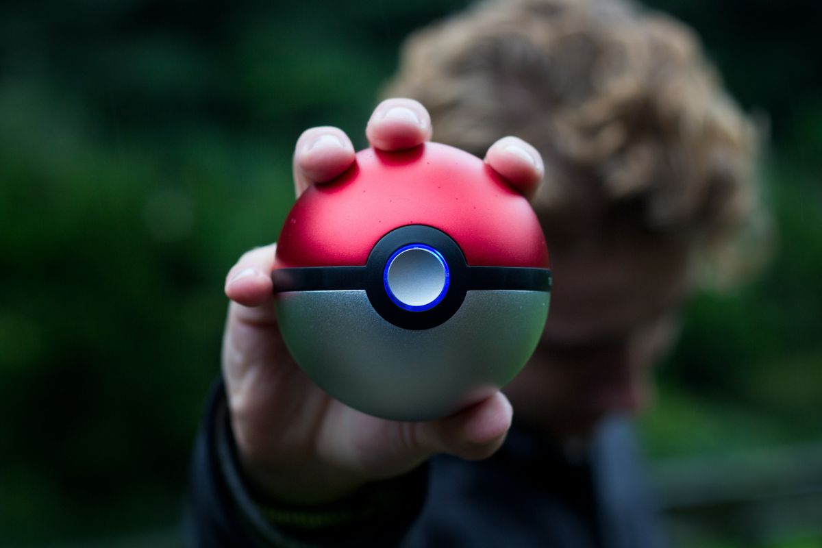 A pokeball held in a hand