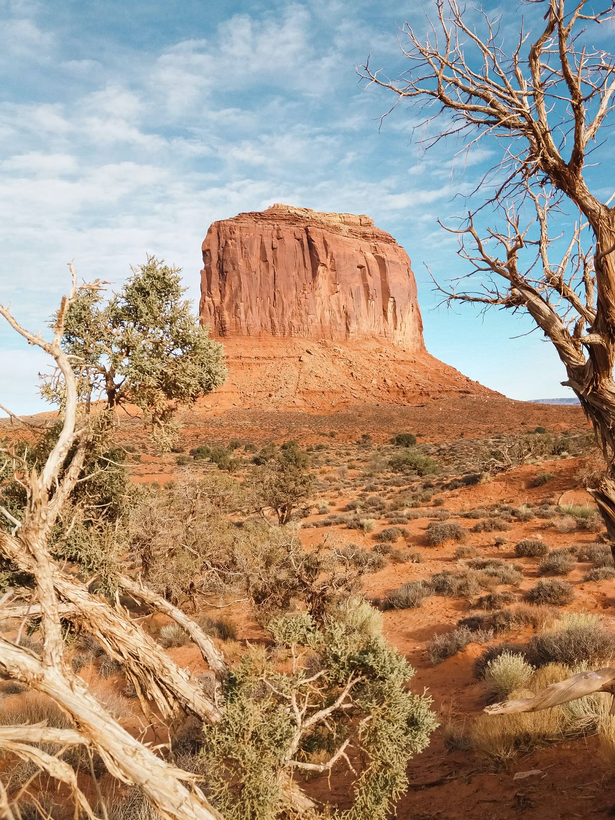 A butte photographed across a red desert